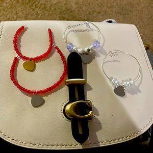 Little girl, playing bracelets that I'm working on